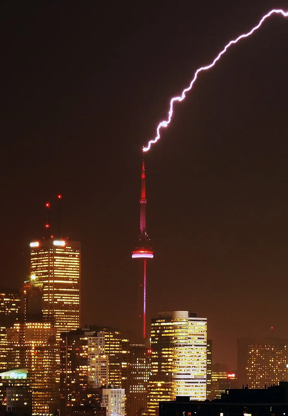 Lightning striking the CN Tower in Toronto at night, a structure far taller than the 150 ft rolling sphere radius