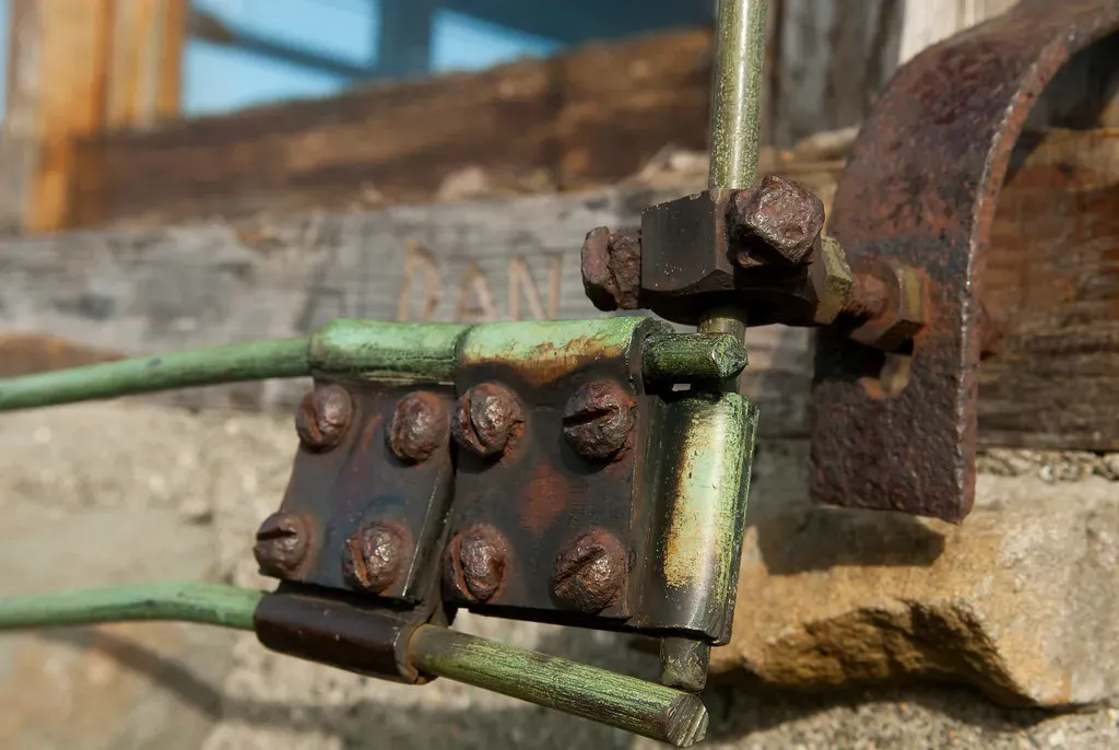 Corroded bolted clamps joining old lightning protection conductors