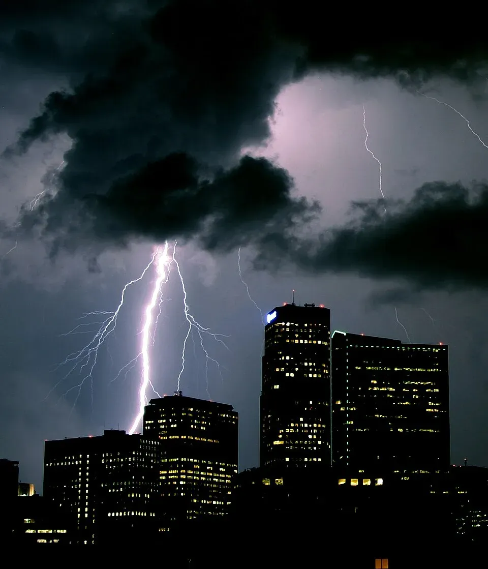 Lightning bolt striking west of downtown Denver, Colorado at night