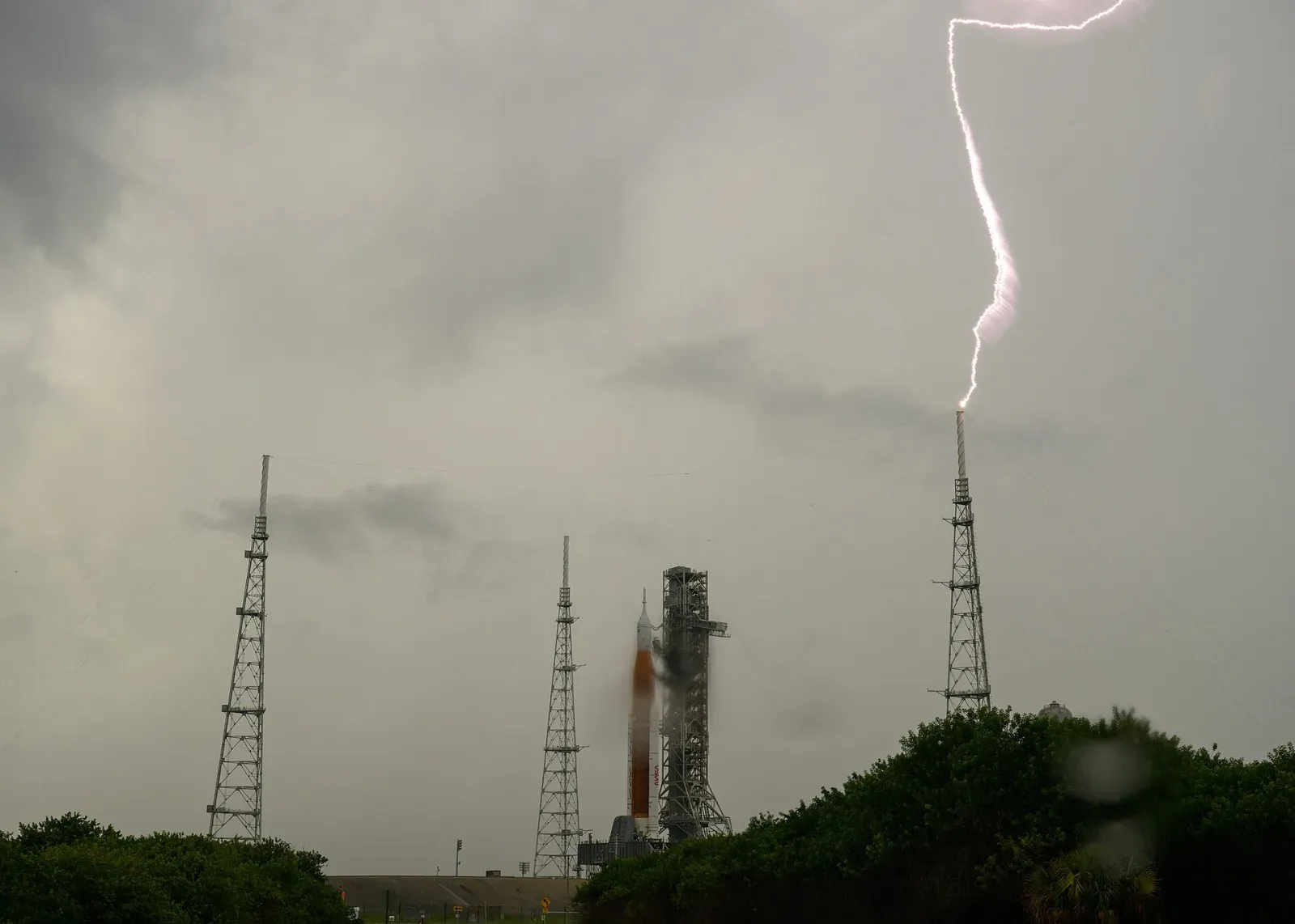 Lightning striking a lightning protection tower at Launch Pad 39B, showing how a lightning rod takes the strike