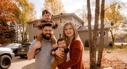 Family in front of their home